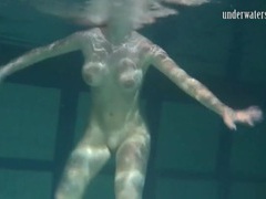 RefleXXX presents: Naked brunette with big tits swims solo