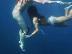 RefleXXX presents: Bikini girls swim in the ocean and strip
