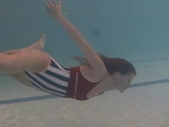 RefleXXX presents: Leggy girl swims and strips naked in pool