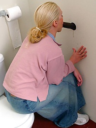 RefleXXX presents: Blonde girl Jamie sits on the toilet and blows a black gloryhole dong